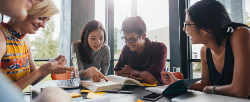 University students doing group study in library