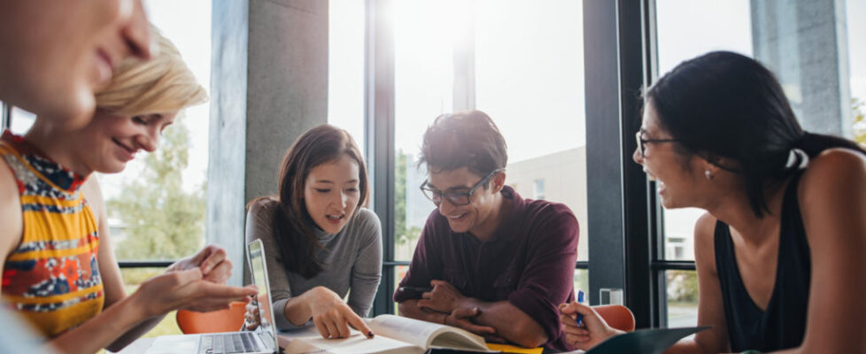 University students doing group study in library